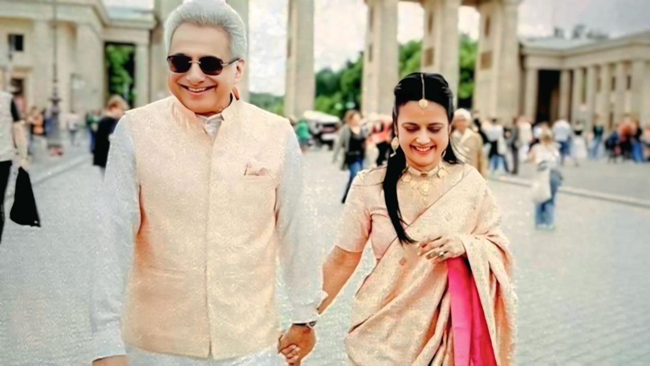 Mahua Moitra and Pinaki Misra wedding photo in Berlin wearing traditional Raw Mango outfits.
